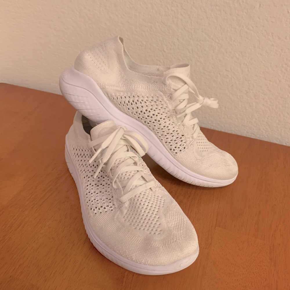 White Nike Flyknit Frees running shoes - women’s size 10